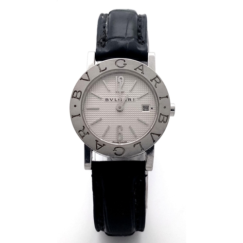 76 - A Bvlgari Quartz Ladies Watch. Black leather strap. Stainless steel case - 27mm. White dial with dat... 