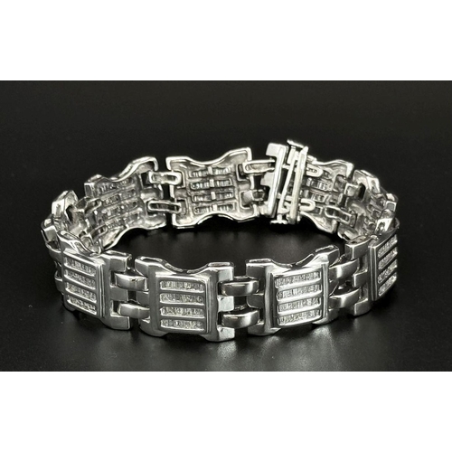 10 - A 9K White Gold Diamond Gate Bracelet. Nine, Four row diamond gates! 18cm. 33g total weight. Ref: 19... 