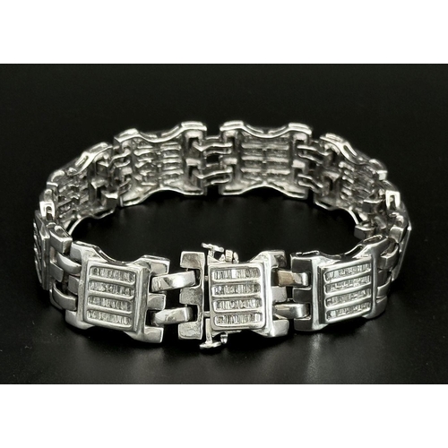 10 - A 9K White Gold Diamond Gate Bracelet. Nine, Four row diamond gates! 18cm. 33g total weight. Ref: 19... 