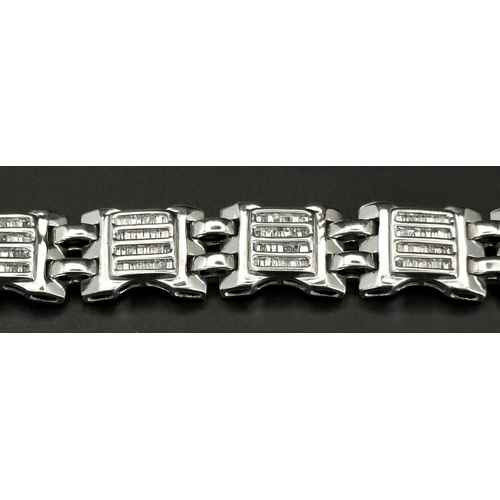 10 - A 9K White Gold Diamond Gate Bracelet. Nine, Four row diamond gates! 18cm. 33g total weight. Ref: 19... 