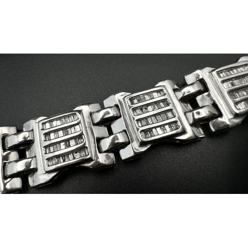 10 - A 9K White Gold Diamond Gate Bracelet. Nine, Four row diamond gates! 18cm. 33g total weight. Ref: 19... 