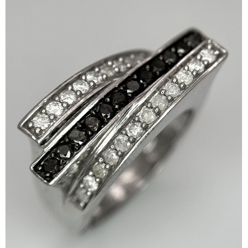 146 - A 9K WHITE GOLD BLACK & WHITE DIAMOND 3 ROW FANCY RING 0.50CT 5.9G SIZE N. Ref: SC 7036