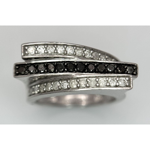 146 - A 9K WHITE GOLD BLACK & WHITE DIAMOND 3 ROW FANCY RING 0.50CT 5.9G SIZE N. Ref: SC 7036