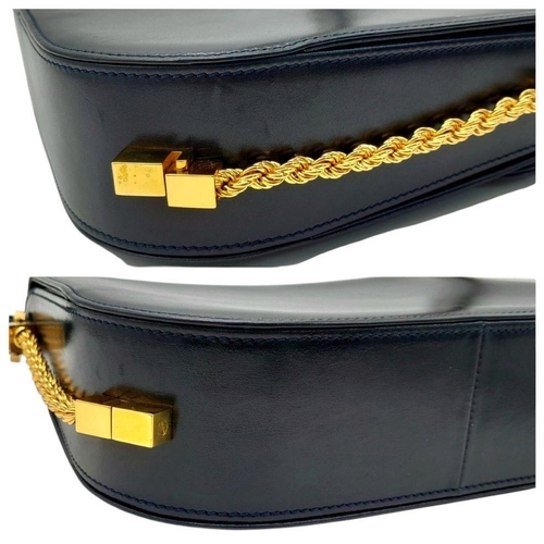 214 - A Bally Navy Blue Leather Shoulder Bag. Navy blue leather exterior with gold-toned hardware, a singl... 