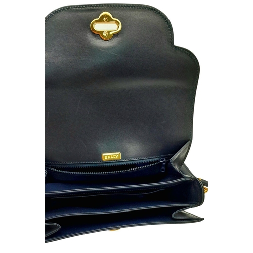 214 - A Bally Navy Blue Leather Shoulder Bag. Navy blue leather exterior with gold-toned hardware, a singl... 