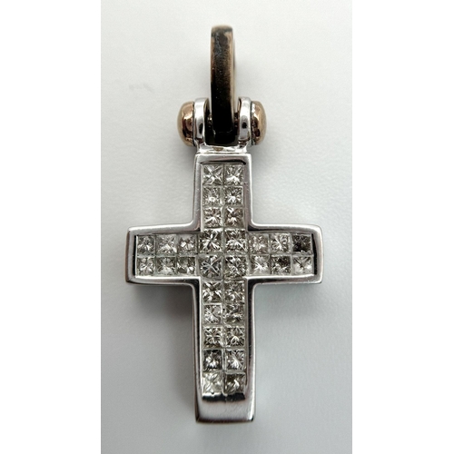 319 - A 14K White Gold Pave Diamond Cross Pendant. Yellow gold bail. 3cm x 1.5cm. 4.9g total weight.  Ref:... 