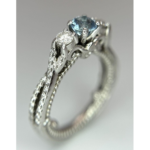 55 - AN 18K WHITE GOLD DIAMOND & TOPAZ 3 STONE RING. 5.8G. SIZE H 1/2.