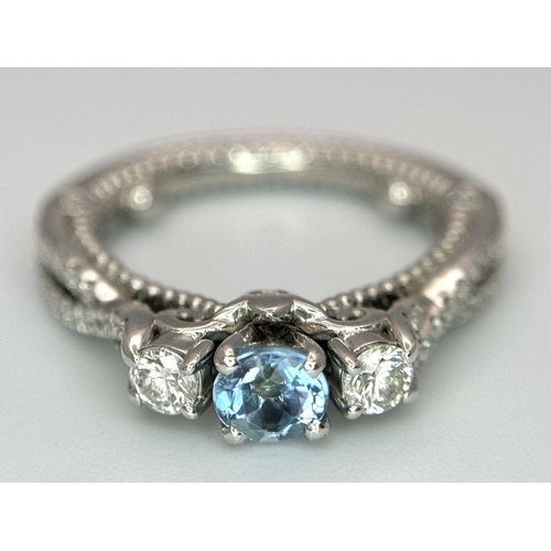 55 - AN 18K WHITE GOLD DIAMOND & TOPAZ 3 STONE RING. 5.8G. SIZE H 1/2.