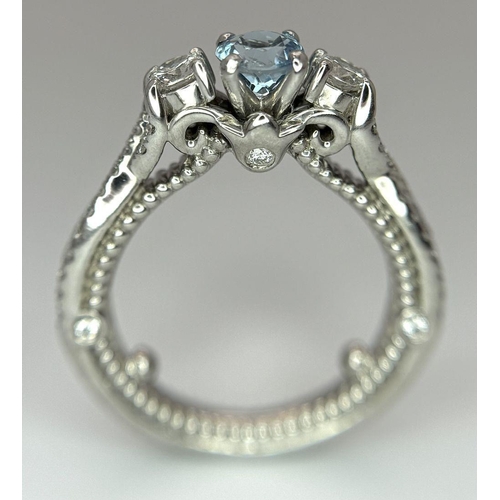 55 - AN 18K WHITE GOLD DIAMOND & TOPAZ 3 STONE RING. 5.8G. SIZE H 1/2.