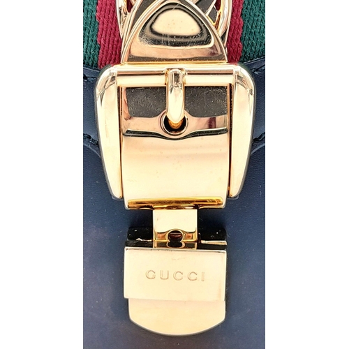 81 - A Gucci Black Calfskin Sylvie Bag. Black calfskin leather exterior with gold-toned hardware, featuri... 