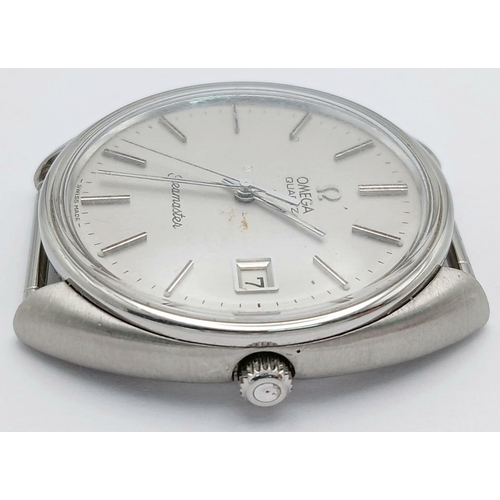 486 - A Vintage Omega Seamaster Watch Case - 36mm. Silver tone dial with date window. In working order.