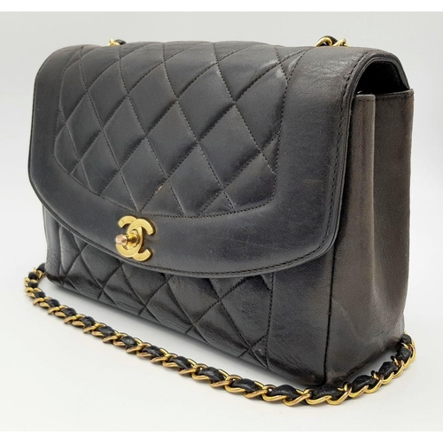 66 - A Chanel Black Quilted Flap Bag. Black leather exterior with gold-toned hardware, featuring the icon... 