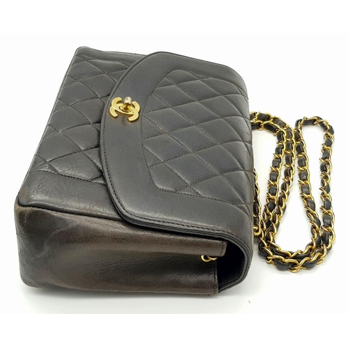 66 - A Chanel Black Quilted Flap Bag. Black leather exterior with gold-toned hardware, featuring the icon... 