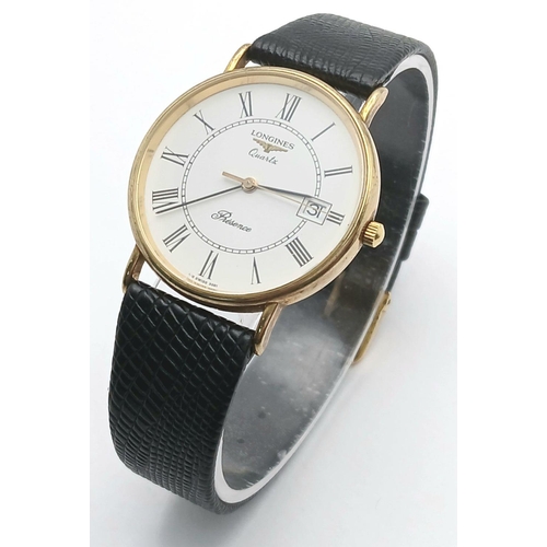 97 - A 9K Gold Cased Longine Quartz Gents Watch. Black leather strap. 9K gold case - 34mm. White dial wit... 