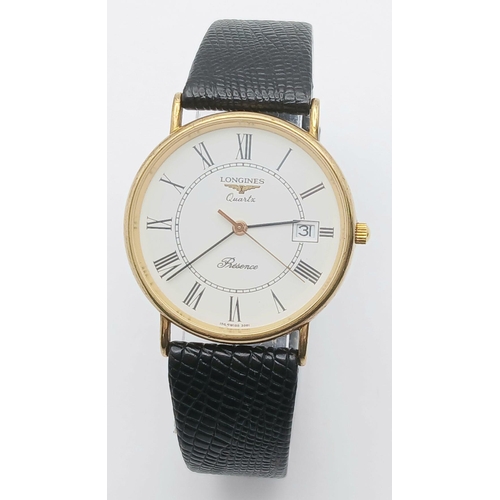 97 - A 9K Gold Cased Longine Quartz Gents Watch. Black leather strap. 9K gold case - 34mm. White dial wit... 