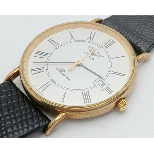 97 - A 9K Gold Cased Longine Quartz Gents Watch. Black leather strap. 9K gold case - 34mm. White dial wit... 