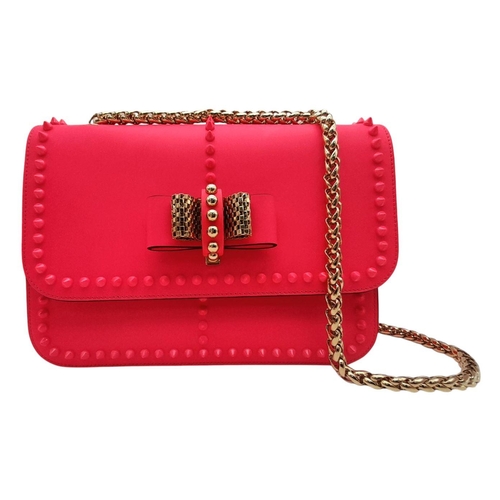 104 - A Christian Louboutin Pink Vara Bow Studded Shoulder Bag. Pink leather exterior with gold-toned stud... 