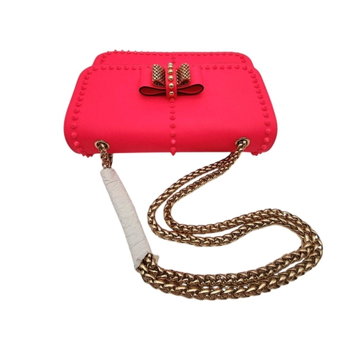 104 - A Christian Louboutin Pink Vara Bow Studded Shoulder Bag. Pink leather exterior with gold-toned stud... 