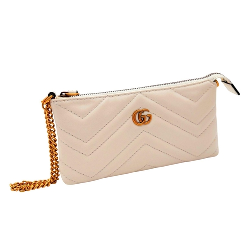 139 - A Gucci White GG Marmont Matelassé Mini Bag. White matelassé leather exterior with chevron stitching... 