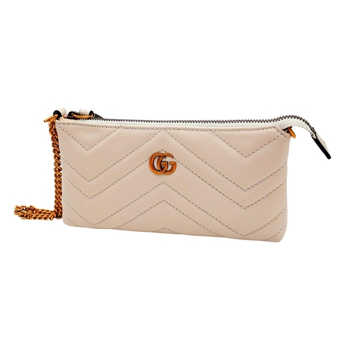 139 - A Gucci White GG Marmont Matelassé Mini Bag. White matelassé leather exterior with chevron stitching... 