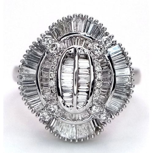 144 - An 18K White Gold and Diamond Dress Ring. 1ctw of round, baguette and tapered baguette diamonds. Stu... 