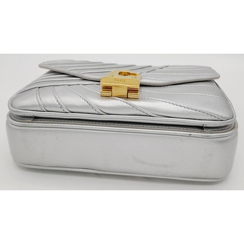 3 - A Celine Metallic Silver Quilted Shoulder Bag. Metallic silver leather exterior with quilted detaili... 