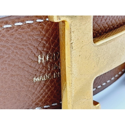 388 - An Hermès Brown Reversible H Belt. 84.5cm total length. Some signs of wear and tear. Please see phot... 