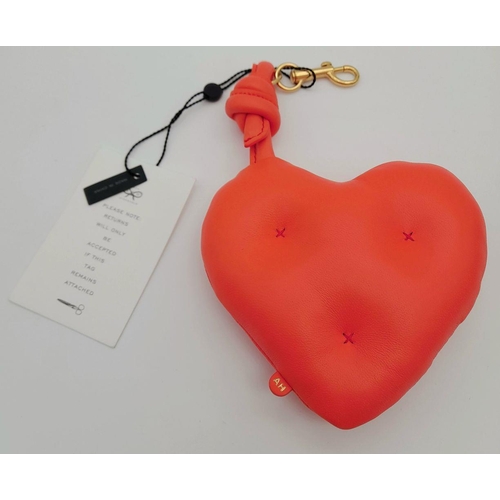 489 - An Anya Hindmarch Heart-Shaped Leather Pouch. Bright red leather exterior with cross-stitch details ... 