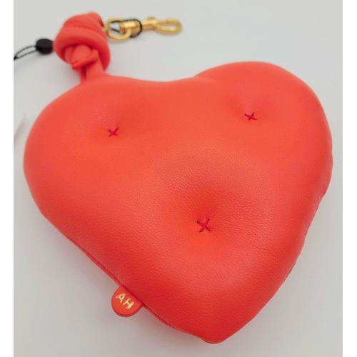 489 - An Anya Hindmarch Heart-Shaped Leather Pouch. Bright red leather exterior with cross-stitch details ... 