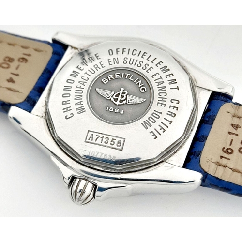 90 - A Breitling (A 71356) Ladies Quartz Watch. Blue leather strap. Stainless steel case - 32mm. Mother o... 