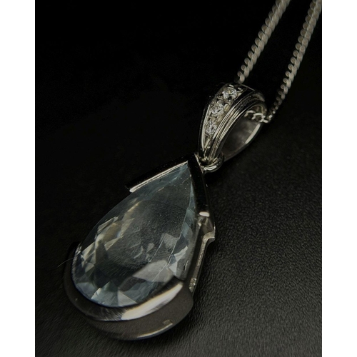 129 - A Beautiful Aquamarine and Diamond Pendant set in 18K White Gold on an 18K White Gold Disappearing N... 