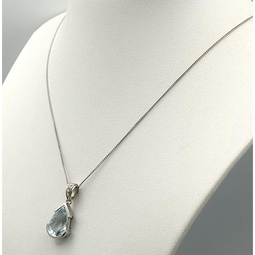 129 - A Beautiful Aquamarine and Diamond Pendant set in 18K White Gold on an 18K White Gold Disappearing N... 