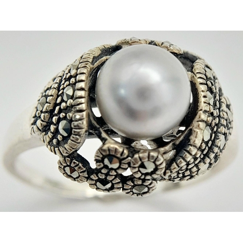 565 - A Vintage or Older Sterling Silver Pearl and Marcasite Set Ring Size Q. The Crown is set with an 8mm... 