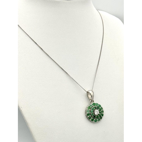 101 - An 18K White Gold, Emerald, Diamond GIA Certified Jewellery Set. An 18K Gold, Emerald, diamond circu... 