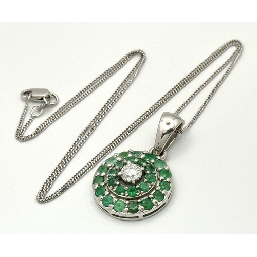 101 - An 18K White Gold, Emerald, Diamond GIA Certified Jewellery Set. An 18K Gold, Emerald, diamond circu... 