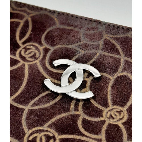 132 - A Chanel Brown Suede Camellia Clutch Bag. Brown suede exterior with Camellia floral motif detailing ... 