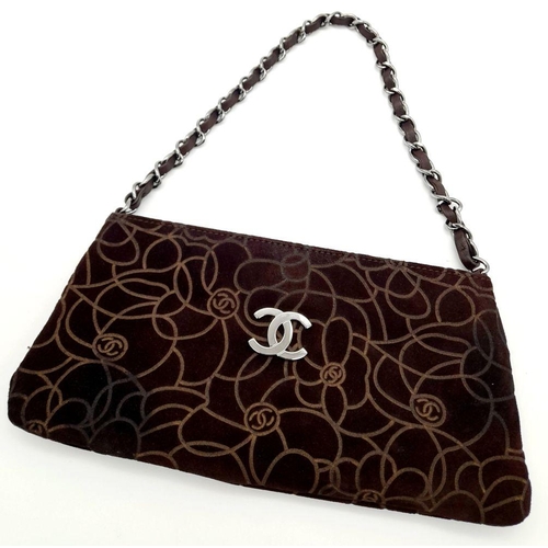 132 - A Chanel Brown Suede Camellia Clutch Bag. Brown suede exterior with Camellia floral motif detailing ... 