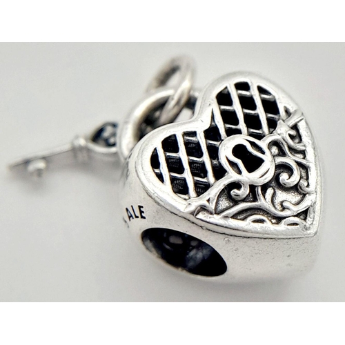 900 - A PANDORA STERLING SILVER HEART LOCKET & KEY CHARM 3.6G TOTAL WEIGHT, 1CM x 1CM. Ref: SC 8037