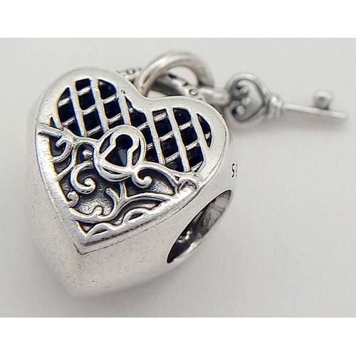 900 - A PANDORA STERLING SILVER HEART LOCKET & KEY CHARM 3.6G TOTAL WEIGHT, 1CM x 1CM. Ref: SC 8037