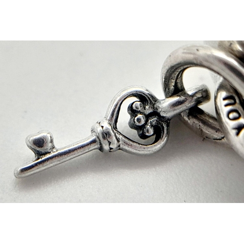 900 - A PANDORA STERLING SILVER HEART LOCKET & KEY CHARM 3.6G TOTAL WEIGHT, 1CM x 1CM. Ref: SC 8037