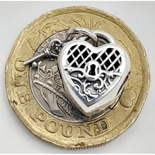 900 - A PANDORA STERLING SILVER HEART LOCKET & KEY CHARM 3.6G TOTAL WEIGHT, 1CM x 1CM. Ref: SC 8037