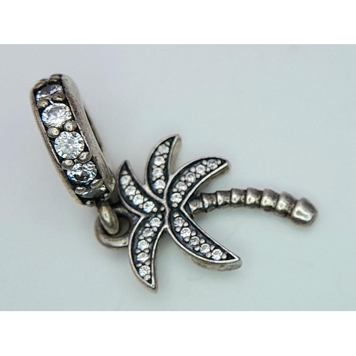879 - A PANDORA STERLING SILVER STONE SET PALM TREE DANGLE CHARM 2.6G TOTAL WEIGHT, 2.5CM x 1CM. Ref: SC 8... 