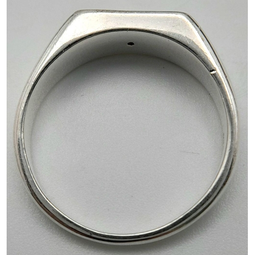 957 - A Sterling Siver Diamond Set Signet Ring Size N1/2. The Crown Measures 1.1 x 6mm. Set with a central... 
