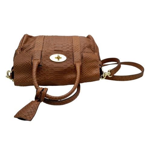 1012 - A Mulberry Small Bayswater Satchel Bag. Textured exterior with gold tone furniture. Comes with a rem... 