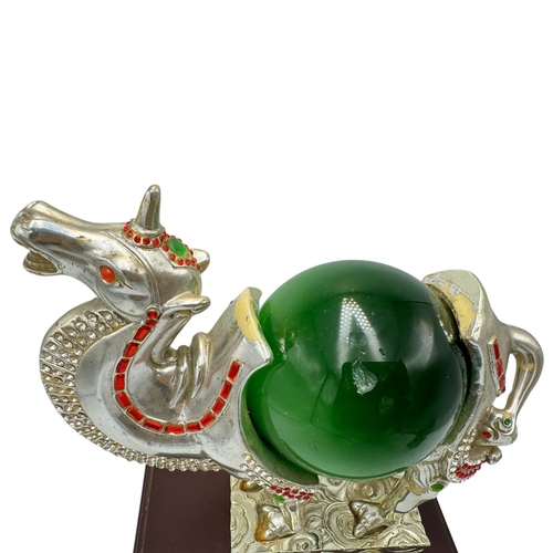 483 - A fantastic collector's piece: natural Cat's Eye Stones set in a Feng Shui Camel Symbol. Expertly cr... 