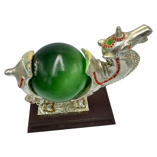 483 - A fantastic collector's piece: natural Cat's Eye Stones set in a Feng Shui Camel Symbol. Expertly cr... 