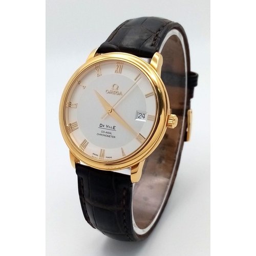 83 - An Omega Deville Prestige 18K Gold Cased Watch. Black leather strap with original gold buckle. 18k g... 