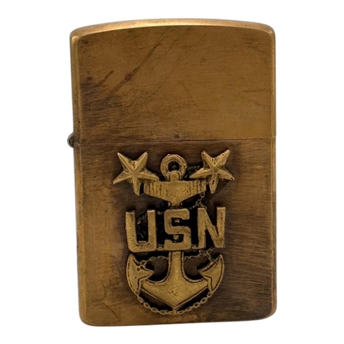 384 - A Vietnam war era US Navy Anchor Zippo Lighter. Approximately 5.5cm height x 3.5cm width. Please see... 