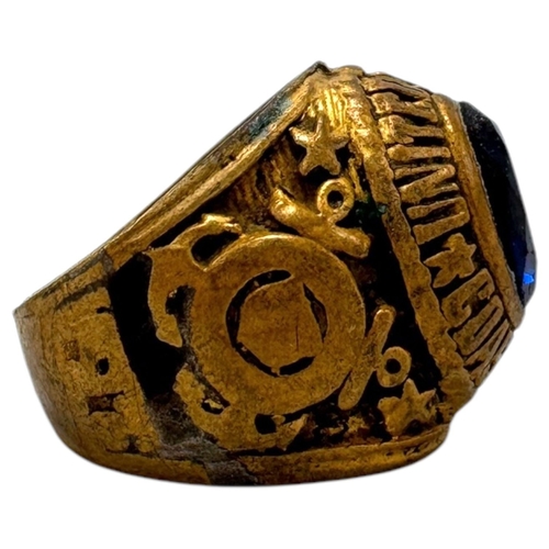 902 - A Vietnam war era US Coast Guard fraternity Ring, featuring a central dark blue oval stone and a sta... 