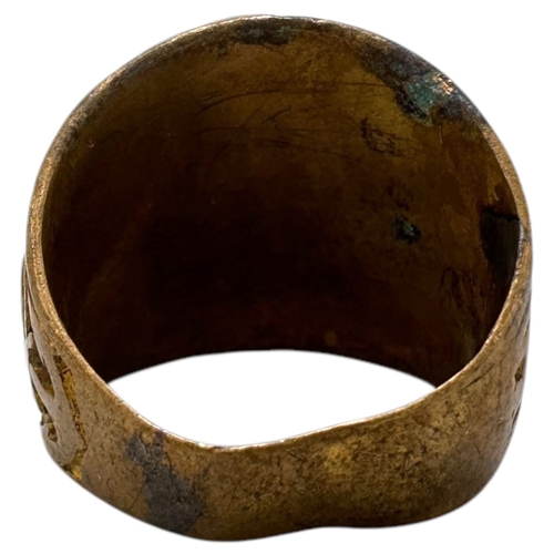 902 - A Vietnam war era US Coast Guard fraternity Ring, featuring a central dark blue oval stone and a sta... 